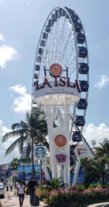 Giant Ferris wheel and entrance sign for La Isla Shopping Village in Cancún, Mexico